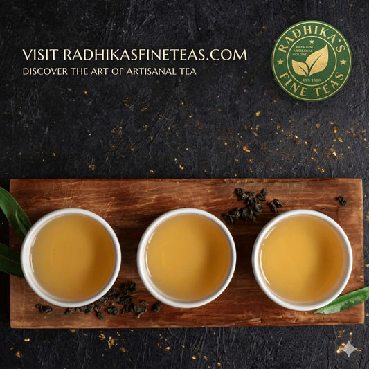 Three cups of tea on a wooden board with Radhika's Fine Teas branding.