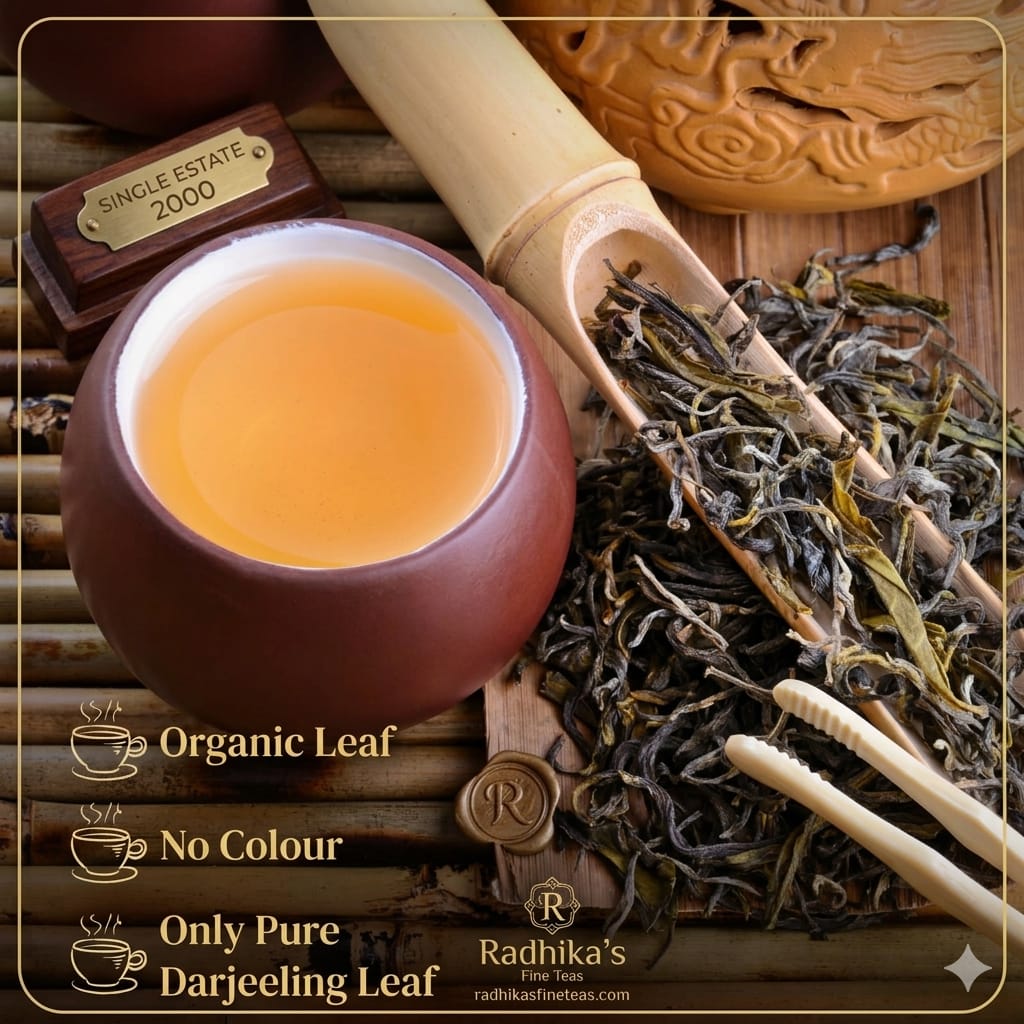 Tea cup with tea leaves and Radhika's Fine Teas branding on a wooden background