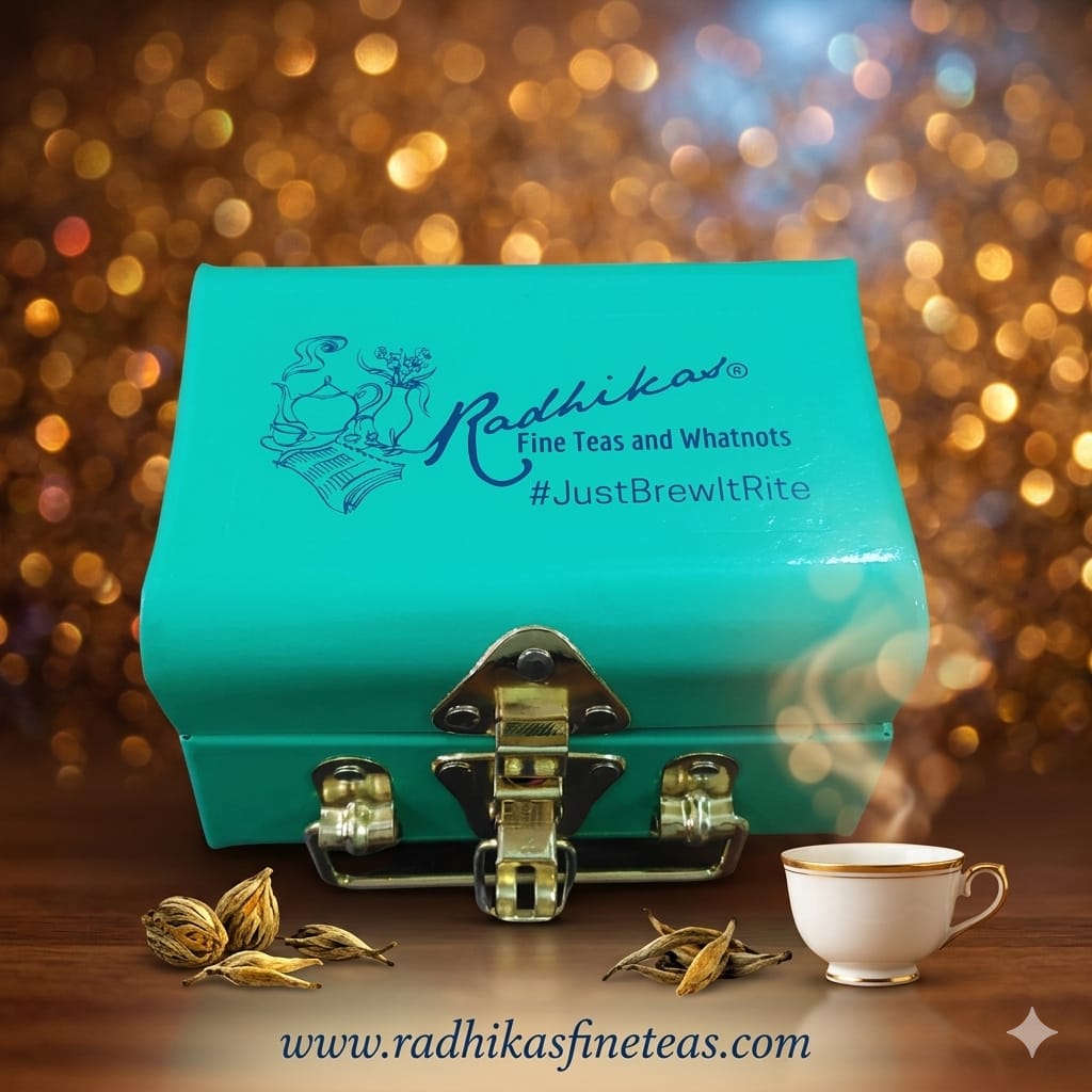 Turquoise box with Radhika's branding, tea leaves, and a steaming cup on a blurred background