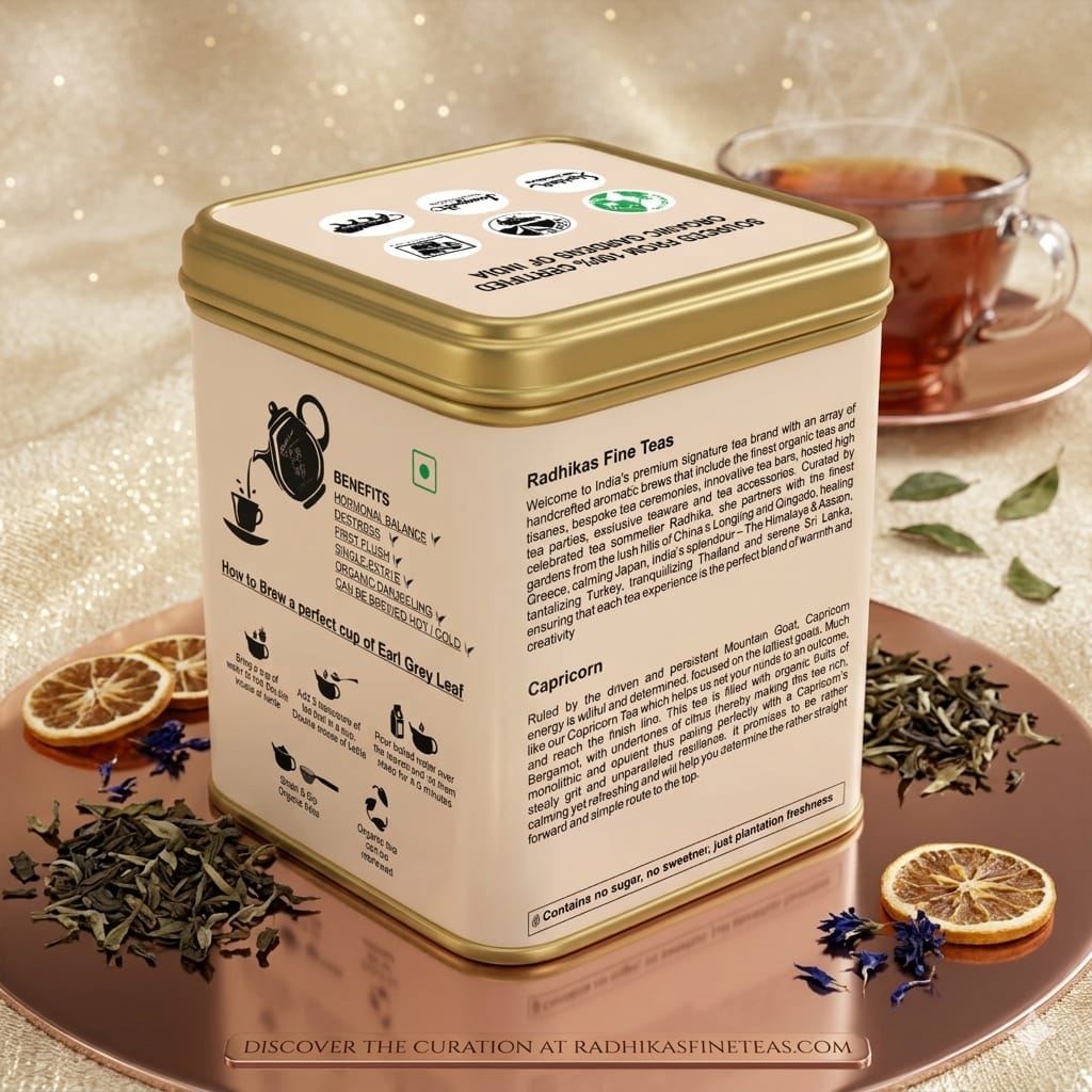 Tea tin with tea leaves and a cup of tea on a decorative surface