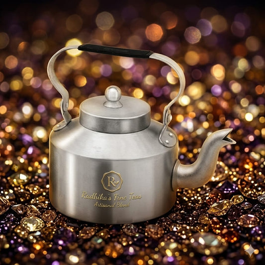 Silver teapot with a blurred, colorful background