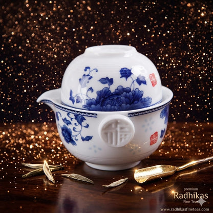 White teapot with blue floral patterns on a dark, glittery background