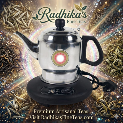 Tea kettle on a stand with Radhika's Fine Teas branding and tea leaves in the background.