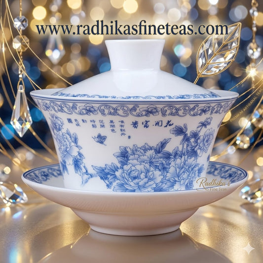 White teacup with blue floral patterns on a decorative background with crystals and lights.
