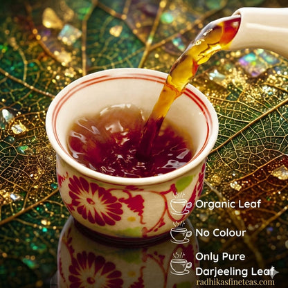 Tea being poured into a decorative cup on a leaf-patterned surface with branding text.