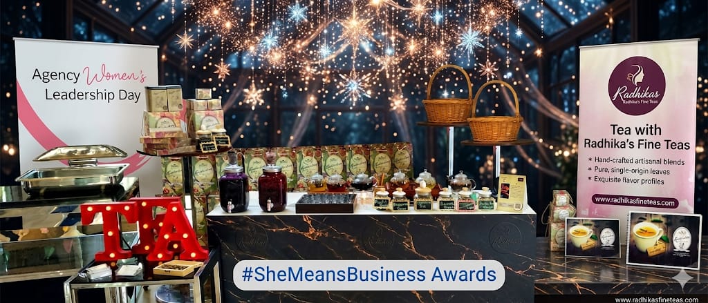 Tea display with Radhika's Fine Teas branding at an event with '#SheMeansBusiness Awards' text.