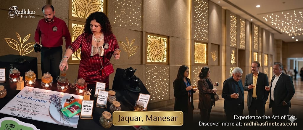 Event or product launch with people around a table displaying items, against an elegant interior background.