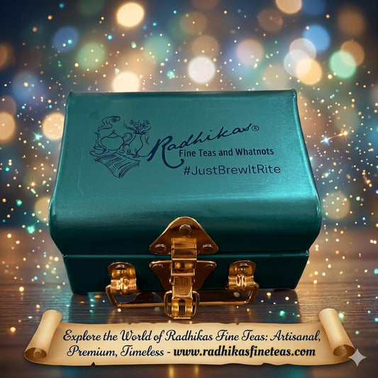 Teal tea box with gold clasp on a sparkling background, featuring Radhika's Fine Teas branding.