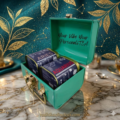 Tea canisters labeled 'Aries' and 'Aquarius' in a teal box with decorative background.