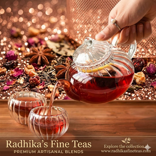 Tea being poured from a glass teapot into a cup with Radhika's Fine Teas branding.