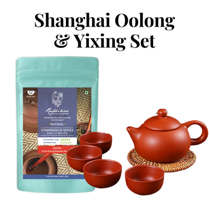 A bundle including a bag of Shanghai Oolong Tea and a set of Yixing teaware, with one visible red cup and a kettle on a mat, all against a white background.